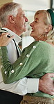Dancing, love and senior couple in home with music, playlist or radio for bonding together. Happy, groove and elderly man with woman for album with rhythm in living room for romance in apartment.