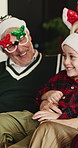 Christmas, girl and family in lounge, smile and bonding together with holiday, love and funny. Home, people and parent on sofa, daughter and happiness with humor, Xmas and laughing with celebration