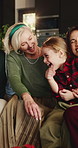 Christmas, girl and family in home, funny and bonding together with holiday, relax and smile. Apartment, excited or people on sofa, daughter and happiness with humor, Xmas and laughing in living room