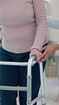 Retirement, nurse or hands in center with walker, checkup or mobility support in rehabilitation care. People, caregiver or patient with disability, walking aid or muscle recovery in nursing home.