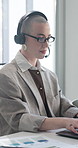 Headset, finance and business woman on laptop for financial advice, online consulting and help. Documents, office and person on computer for contact us, investment options and budget portfolio