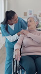 Empathy, nurse and old woman in center with wheelchair, shoulder touch and support in retirement care. Understanding, caregiver and patient with disability, comfort and connection in nursing home.