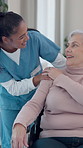 Empathy, nurse and old person in center with wheelchair, shoulder touch and support in retirement care. Understanding, caregiver and patient with disability, comfort and connection in nursing home.