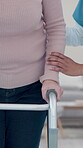 Retirement, nurse or hands in center with walker, checkup or mobility support in rehabilitation care. People, caregiver or patient with disability, walking aid or muscle recovery in nursing home.