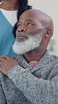 Comfort, shoulder and caregiver with senior man in nursing home for support, sympathy and care. Retirement, healthcare and elderly person with nurse for assisted living, compassion and understanding