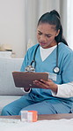 Woman, caregiver and reading with clipboard for checkup questions, survey and medical report. Person, consultation or checklist for healthcare evaluation, symptoms notes and treatment results in home