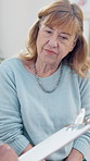 Therapist, clipboard and senior woman in office for counseling, assessment and mental health. Elderly person, psychologist and checklist for therapy session, evaluation and information for treatment