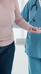 Holding hands, physiotherapy and support for patient in retirement for balance, recovery or wellness. Person with disability, medical professional and help for walk, steps or rehabilitation at clinic