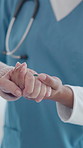 Holding hands, physiotherapy and help for patient in retirement for balance, recovery or wellness. Person with disability, medical professional and support for walk, steps or rehabilitation at clinic