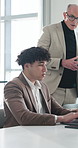 Business, man and mentor with laptop in office for research, training intern and finance report. Person, manager and talking with tech for coaching, review budget and feedback on financial proposal