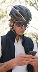 Outdoor, cycling and delivery man with smartphone, online or searching for directions on digital map. Reading, message and person with mobile app for order update, flare and check location with tech