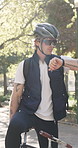 Fitness, smartwatch or man in park with cycling, endurance training or progress track in cardio workout. Digital, bike or cyclist with tech, physical activity or outdoor hobby with performance check.