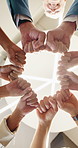 Low angle, fist bump and business people in office, investor and support for profit increase. Below, employees and financial advisor in workplace, hand gesture or meeting for trading mission or goals