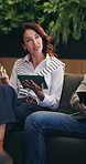 Woman, tablet and meeting in sofa at office for discussion, insight or review at insurance company. Mature broker, tech and team for planning on app, strategy or feedback at risk management agency