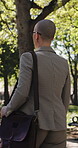 Walk, back or businesswoman in park with thinking, mindfulness or inspiration in morning travel. Commuting, reflection or employee with glasses, outdoor stroll or perspective at start of day.