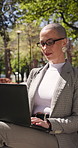 Laptop, thinking and businesswoman outdoor in park with research for legal case on conservation. Technology, nature and environmental lawyer with computer for planning with eco friendly project.