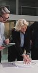 Business people, team and tablet with documents at office in night with planning, review and discussion. Woman, men and tech with paperwork, report and talk with asset management at finance agency