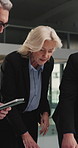Business people, team and discussion with documents at office in night with planing, review and tablet. Woman, men and tech with paperwork, insight and feedback for asset management at finance agency