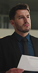 Thinking, lawyer and man with documents at night for reading contract, case study and legal strategy. Attorney, office and person with paperwork for planning, solution and reflection for court trial