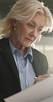 Investor, writing and woman in office, documents and strategy for investment deal. Mature person, employee and broker in workplace, report for profit increase and audit for company growth or planning