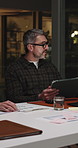 Meeting, business people and tablet at night for management, feedback or story engagement. Publishing agency, editor report and digital tech for news update, topics review or blog planning advice