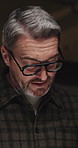 Phone, discussion and businessman in office at night for policy review with international client. Meeting, cellphone and mature male insurance advisor with deadline for risk assessment in workplace.