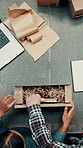 Laptop screen, packing or people with box in warehouse, supply chain or teamwork for leather product order. Above, textile startup and employees with package for shipping preparation, pc or ecommerce