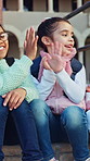 Girl, children and happy with high five at school on stairs with support, backpack and outdoor for learning. Kids, group and excited with celebration, scholarship and playful with friends at academy