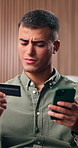 Confused, man and credit card in house with phone, decline payment or problem for online shopping. Frustrated, person and fintech issue in home with digital banking error, ecommerce challenge or fail