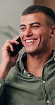 Happy, man and conversation in living room with phone call, news and gossip update on weekend break. Person, smile and digital tech in house with contact, network and connectivity for communication.