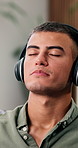 Podcast, breathe and man listening with headphones for meditation, instruction or sound to relax. Audio guide, mindful visualization and person with positive affirmation track, tech or rest in home