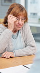 Reading, home and senior woman with documents for mortgage and asset management. Business agent, glasses and consulting with elderly client for insurance policy, conversation or pension checklist