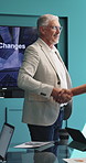 Handshake, presentation and people in office, negotiation for investment deal and agreement for prices. Mature person, financial advisor and professional in meeting, shaking hands and partnership 