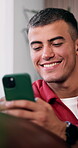 Reading, laughing and man with mobile in home, funny online conversation and internet meme for texting. Message app, social media and happy person with phone for comedy video, browsing and connection
