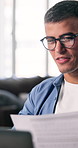 Man, documents or video call with laptop in office for virtual meeting or discussion. Male person, employee or talking with paperwork or computer for webinar, online chat or conversation in workplace