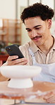 Series, small business and technology with man in boutique for billing, retail sales or stock management. Ceramic product, invoice and phone screen with employee in studio startup for creative design