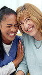 Old woman, nurse and laugh on sofa in home with hug, memory or funny story with assisted living. People, caregiver and senior patient with embrace, connection or joke for gossip on couch at house
