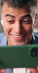 Video game, smartphone and man in home, playing for competition and smile for victory. Apartment, mobile user and person with happiness, internet and digital app for virtual esports and entertainment