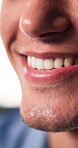Happy man, mouth and consultant with smile in home for advice, communication or customer service. Closeup, male person or friendly agent with conversation for assistance, support or help in house