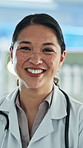 Face, doctor and woman in hospital, smile and medical service with career ambition. Japanese person, professional and employee in clinic, happiness and stethoscope with about us, healthcare and pride