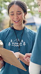 Woman, clipboard and counselor at summer camp with conversation, schedule or help with agenda. Team, discussion and checklist for youth program with planning, advice or task delegation in nature park