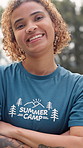Summer camp, crossed arms and face of woman in nature with confidence, pride and volunteering. Forest, happy and portrait of counselor smile for outdoor program, youth facility and camping adventure