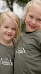 Face, kids and happy at summer camp for bonding together, positive growth and friendship. Friends, girl children or confidence on campsite for social development, holiday program or support in nature