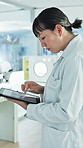 Tablet, woman and scientist in lab for research, scroll or experiment records for drugs development. Tech, science and Asian person with pharma report, medical journal or reading study for chemistry