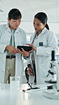 Science, discussion or women in lab with tablet, study review or feedback on experiment report. Teamwork, digital or scientist with tech, medical research or partner insight on clinical trial results