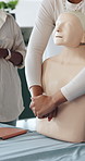 Healthcare, mannequin and woman with first aid training in office for choking safety demonstration. Medical, practice and female person with abdominal compression for simulation on paramedic protocol