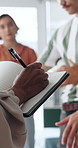 Hands, notebook and writing with training for first aid, teaching and staff workshop at office. Person, coach and team with list, learning or presentation with discussion for emergency response