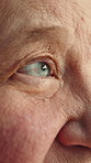 Thinking, vision and eyes of senior woman with memory loss, dementia and reflection in retirement. Thoughtful, closeup and elderly person with nostalgia, doubt and wondering with Alzheimers in home