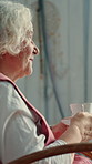 Old woman, window and thinking with coffee in home for vision, memory and relax in rocking chair. Senior person, tea cup and drink in house for retirement, peace and reflection for ideas and memories