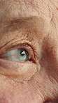 Thinking, closeup and eyes of senior woman with memory loss, dementia and reflection in retirement. Thoughtful, blink and elderly person with nostalgia, remember and wondering with Alzheimers in home